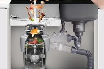 Garbage disposal under a kitchen sink