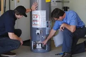 Plumber installing a water heater
